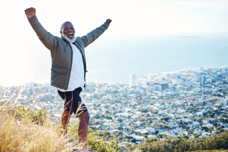Portrait black man on mountain and excited with exercise celebration and view for fitness happiness and hiking Face African American male athlete and mature gentleman with smile and training